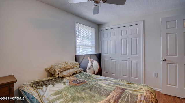 21 Parkview Way, Manalapan, NJ 07726 - bedroom featuring a closet, a textured ceiling, wood finished floors, and ceiling fan