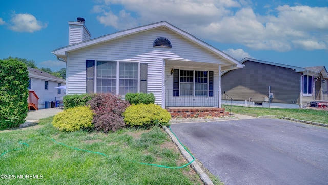 21 Parkview Way, Manalapan, NJ 07726 - view of front of property with a porch and a chimney