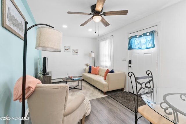 24 Highland Ave, Keansburg, NJ 07734 - living room featuring wood finished floors, a baseboard radiator, recessed lighting, and a ceiling fan