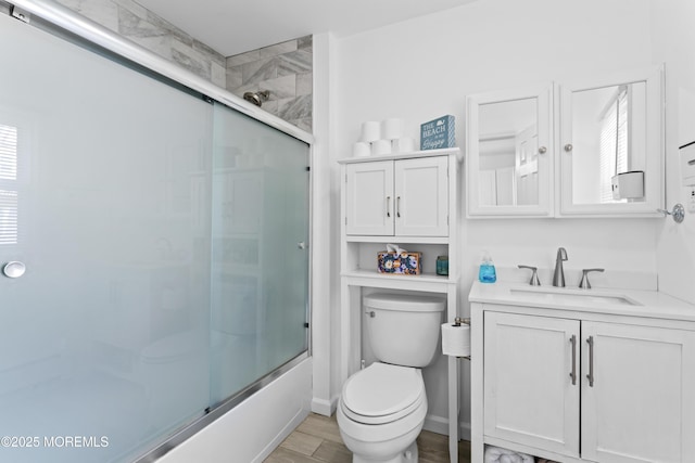 20 Highland Ave, Keansburg, NJ 07734 - bathroom featuring toilet, vanity, and shower / bath combination with glass door