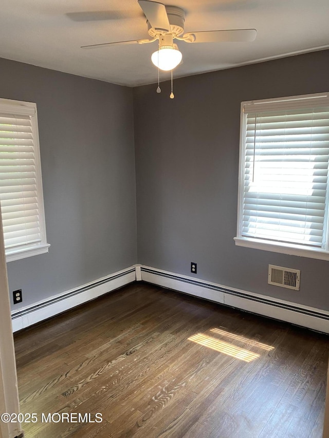 184 Washington Ave, Matawan, NJ 07747 - empty room featuring a ceiling fan, dark wood-style flooring, and a baseboard heating unit
