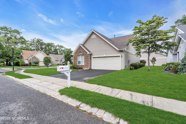 143 Sylvan Lake Blvd, Bayville, NJ 08721 - view of front of home featuring driveway, a garage, brick siding, and a front lawn