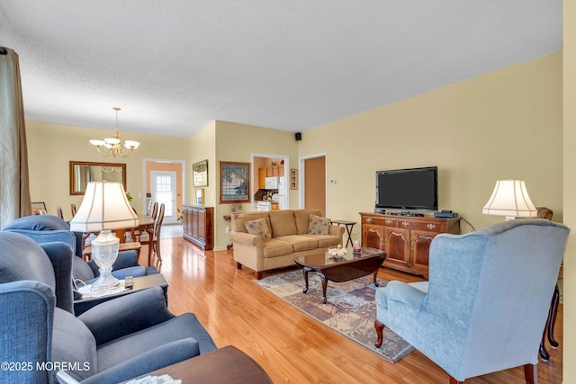 143 Sylvan Lake Blvd, Bayville, NJ 08721 - living room featuring a chandelier and light wood-type flooring
