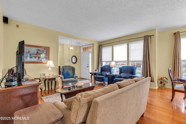 143 Sylvan Lake Blvd, Bayville, NJ 08721 - living room featuring light wood-type flooring and a textured ceiling
