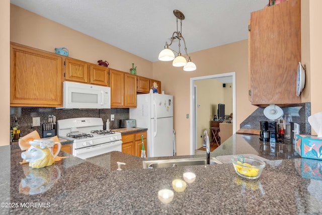 143 Sylvan Lake Blvd, Bayville, NJ 08721 - kitchen featuring white appliances, backsplash, and dark stone countertops