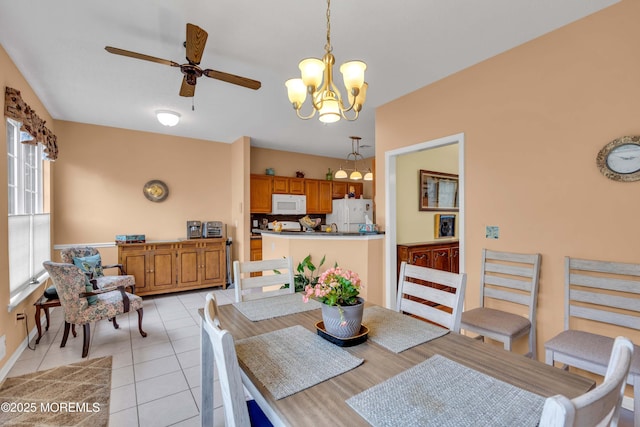 143 Sylvan Lake Blvd, Bayville, NJ 08721 - dining space with light tile patterned floors, a chandelier, and ceiling fan