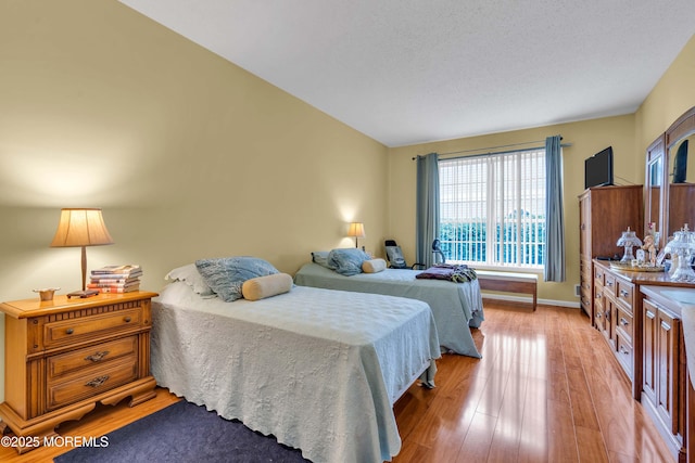 143 Sylvan Lake Blvd, Bayville, NJ 08721 - bedroom with light wood-style floors and baseboards