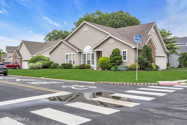 143 Sylvan Lake Blvd, Bayville, NJ 08721 - view of front facade featuring a front yard and roof with shingles