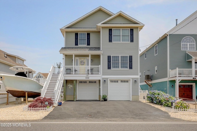 728 Drum Point Rd, Brick, NJ 08723 - coastal home with driveway, a garage, covered porch, and stairway