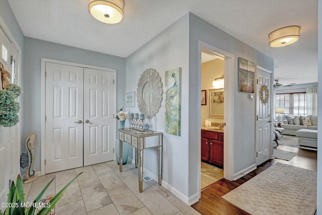 728 Drum Point Rd, Brick, NJ 08723 - foyer with baseboards and a ceiling fan
