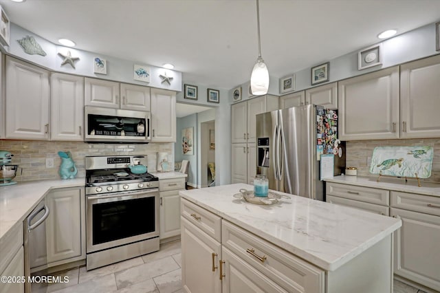 728 Drum Point Rd, Brick, NJ 08723 - kitchen featuring appliances with stainless steel finishes, tasteful backsplash, recessed lighting, light stone countertops, and decorative light fixtures