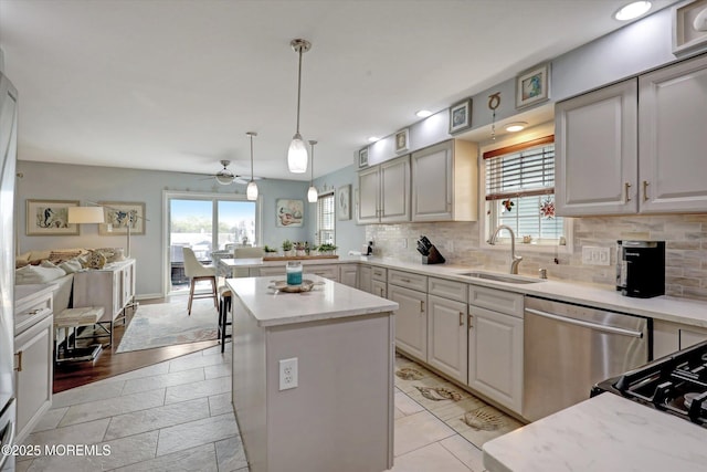 728 Drum Point Rd, Brick, NJ 08723 - kitchen featuring stainless steel dishwasher, healthy amount of natural light, tasteful backsplash, open floor plan, and recessed lighting