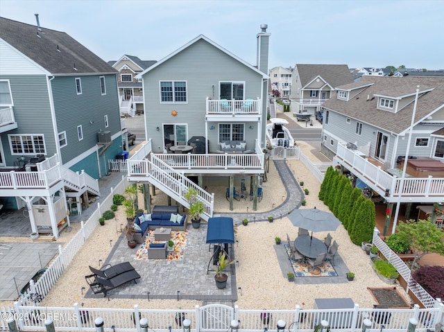 728 Drum Point Rd, Brick, NJ 08723 - back of property featuring a fenced backyard, outdoor dining space, a patio, a residential view, and a gate