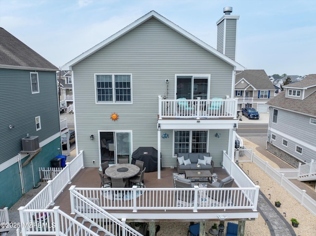 728 Drum Point Rd, Brick, NJ 08723 - rear view of house with an outdoor hangout area, a fenced backyard, a wooden deck, and outdoor dining space
