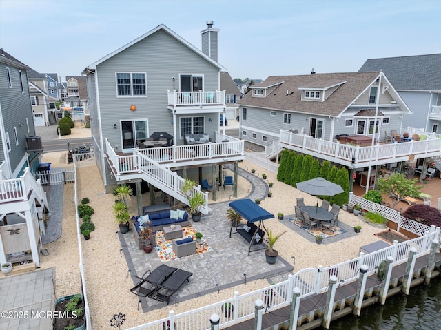 728 Drum Point Rd, Brick, NJ 08723 - rear view of property with a fenced backyard, outdoor dining area, a chimney, and stairway
