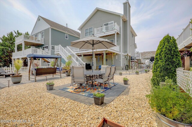 728 Drum Point Rd, Brick, NJ 08723 - rear view of house with a patio, a balcony, stairway, a chimney, and outdoor lounge area