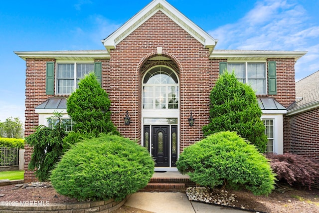 14 Tuscan Dr, Freehold, NJ 07728 - property entrance featuring brick siding and a standing seam roof