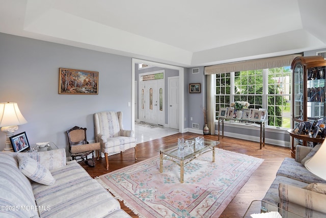 14 Tuscan Dr, Freehold, NJ 07728 - living room with a tray ceiling and light wood-style floors