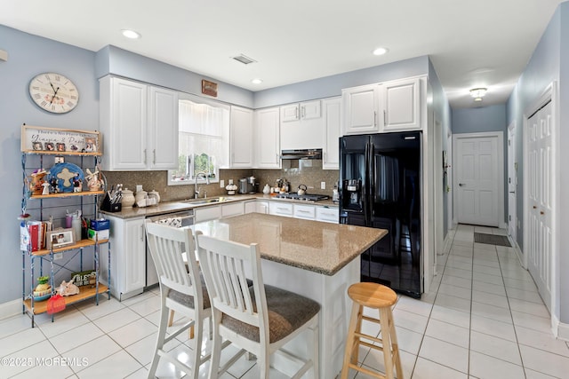14 Tuscan Dr, Freehold, NJ 07728 - kitchen with appliances with stainless steel finishes, a sink, light tile patterned floors, a kitchen bar, and recessed lighting
