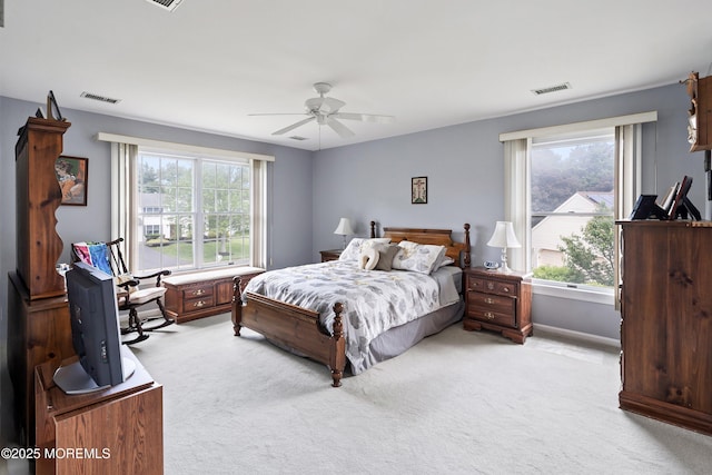14 Tuscan Dr, Freehold, NJ 07728 - bedroom with light carpet, multiple windows, a ceiling fan, and baseboards