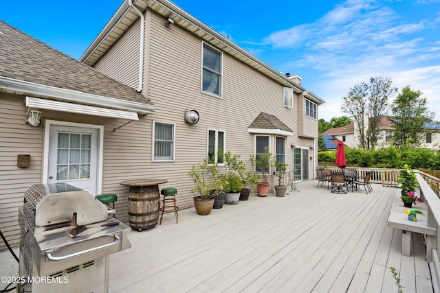 14 Tuscan Dr, Freehold, NJ 07728 - deck with outdoor dining area and a grill