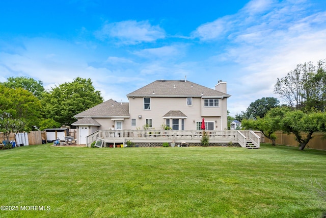 14 Tuscan Dr, Freehold, NJ 07728 - back of house with a chimney, a deck, and a shingled roof
