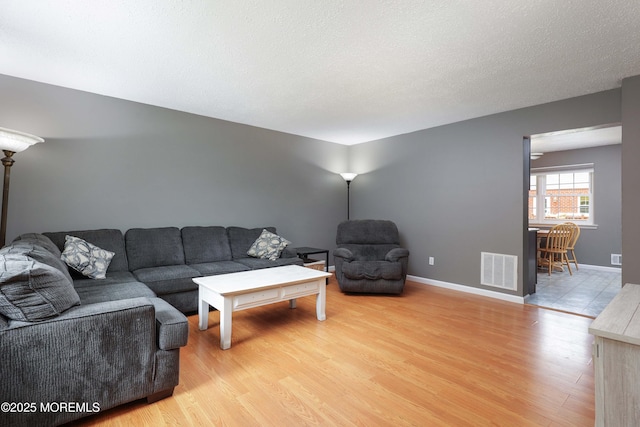 1184 Rachel Ct, Brick, NJ 08724 - living room with light wood-style flooring and baseboards