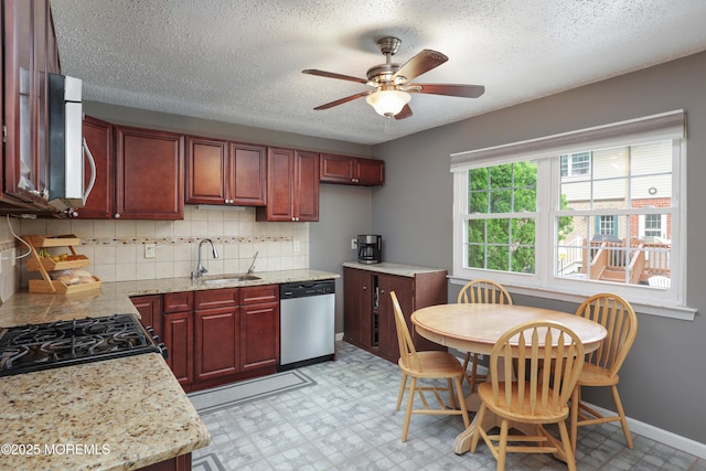 1184 Rachel Ct, Brick, NJ 08724 - kitchen featuring appliances with stainless steel finishes, a sink, ceiling fan, dark brown cabinets, and tasteful backsplash