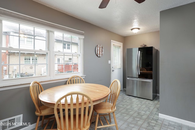 1184 Rachel Ct, Brick, NJ 08724 - dining area with baseboards, ceiling fan, a textured ceiling, and light floors