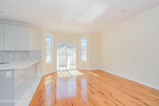 147 Old Bridge Tpke, East Brunswick, NJ 08816 - unfurnished living room with light wood-style floors, baseboards, and ornamental molding