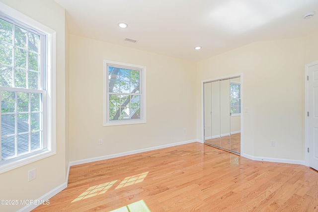 147 Old Bridge Tpke, East Brunswick, NJ 08816 - unfurnished bedroom with multiple windows, light wood finished floors, baseboards, and recessed lighting