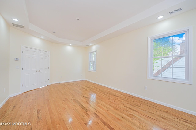 147 Old Bridge Tpke, East Brunswick, NJ 08816 - unfurnished room with light wood-type flooring, a tray ceiling, baseboards, and recessed lighting