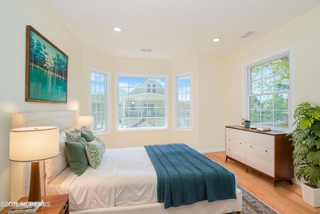 147 Old Bridge Tpke, East Brunswick, NJ 08816 - bedroom with light wood finished floors, multiple windows, and recessed lighting