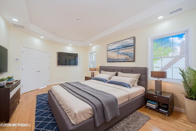 147 Old Bridge Tpke, East Brunswick, NJ 08816 - bedroom featuring a tray ceiling, light wood-style flooring, baseboards, and recessed lighting