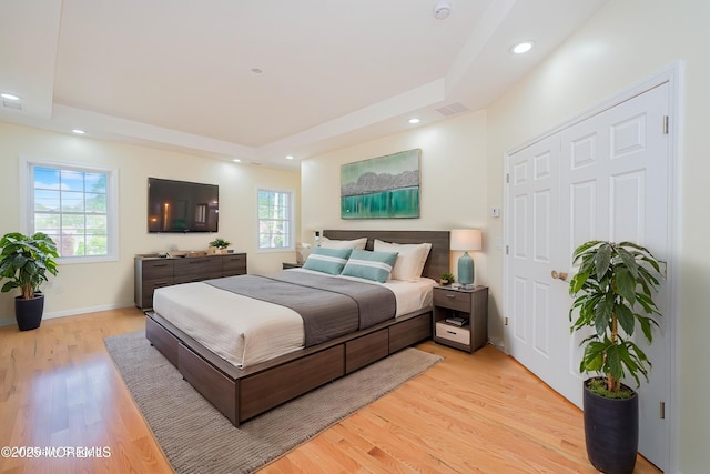 147 Old Bridge Tpke, East Brunswick, NJ 08816 - bedroom with a tray ceiling, light wood-style floors, and recessed lighting