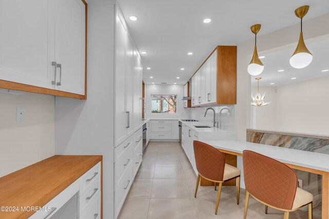 214 Private Way, Lakewood, NJ 08701 - kitchen with a sink, white cabinets, a peninsula, light countertops, and recessed lighting