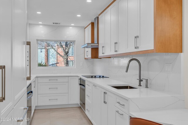 214 Private Way, Lakewood, NJ 08701 - kitchen featuring a sink, oven, black electric cooktop, backsplash, and light stone countertops