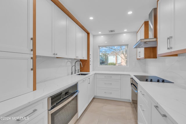 214 Private Way, Lakewood, NJ 08701 - kitchen with oven, a sink, wall chimney range hood, black electric stovetop, and recessed lighting