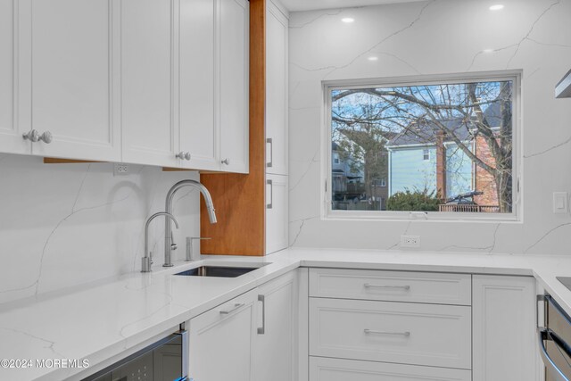 214 Private Way, Lakewood, NJ 08701 - kitchen featuring a sink, white cabinetry, and light stone counters