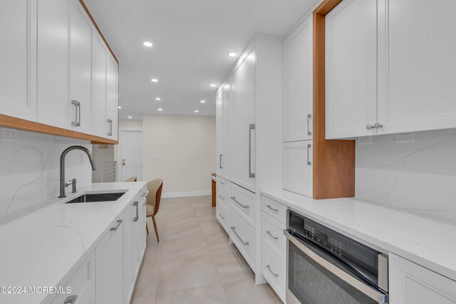 214 Private Way, Lakewood, NJ 08701 - kitchen featuring a sink, oven, white cabinets, tasteful backsplash, and recessed lighting