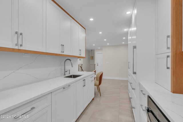 214 Private Way, Lakewood, NJ 08701 - kitchen featuring a sink, white cabinetry, recessed lighting, light stone counters, and baseboards
