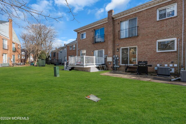 214 Private Way, Lakewood, NJ 08701 - back of house with central air condition unit, a yard, brick siding, a patio area, and a wooden deck