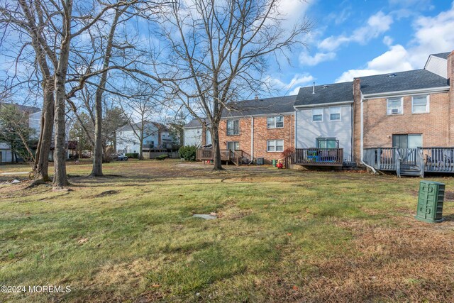 214 Private Way, Lakewood, NJ 08701 - view of green lawn featuring a wooden deck and a residential view