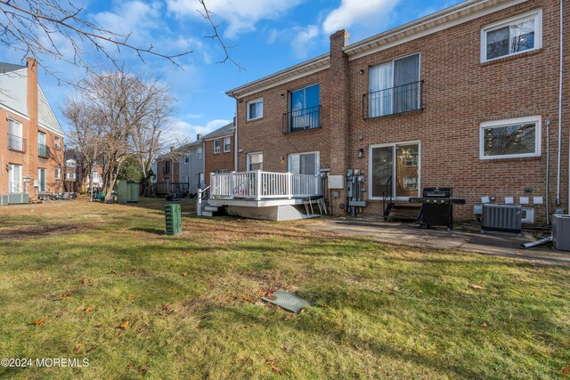 214 Private Way, Lakewood, NJ 08701 - back of house with central air condition unit, a patio, brick siding, and a lawn