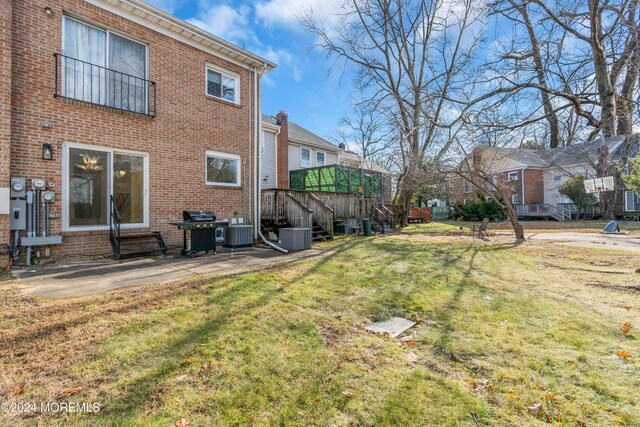 214 Private Way, Lakewood, NJ 08701 - view of grassy yard with central air condition unit, a wooden deck, a patio, and a residential view