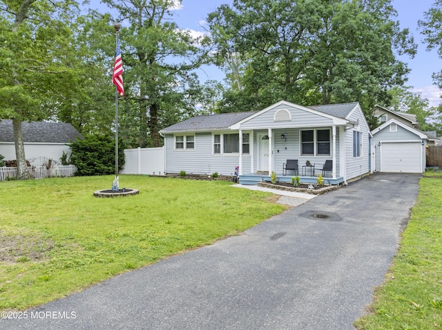 274 Falkenburgh Ave, Forked River, NJ 08731 - view of front of property featuring covered porch, an outdoor structure, asphalt driveway, a detached garage, and a shingled roof