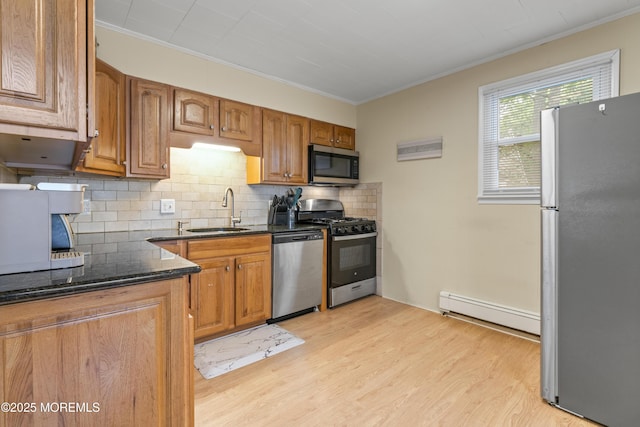 274 Falkenburgh Ave, Forked River, NJ 08731 - kitchen with appliances with stainless steel finishes, a sink, baseboard heating, ornamental molding, and tasteful backsplash
