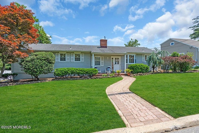 708 Schoolhouse Rd, Brielle, NJ 08730 - single story home featuring a front lawn, a chimney, and covered porch