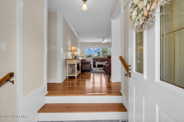 708 Schoolhouse Rd, Brielle, NJ 08730 - entryway with wood finished floors, ornamental molding, and ceiling fan