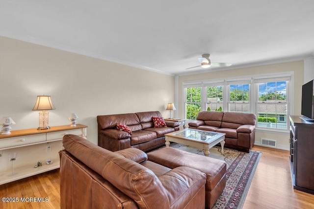 708 Schoolhouse Rd, Brielle, NJ 08730 - living room featuring wood finished floors, a ceiling fan, and ornamental molding